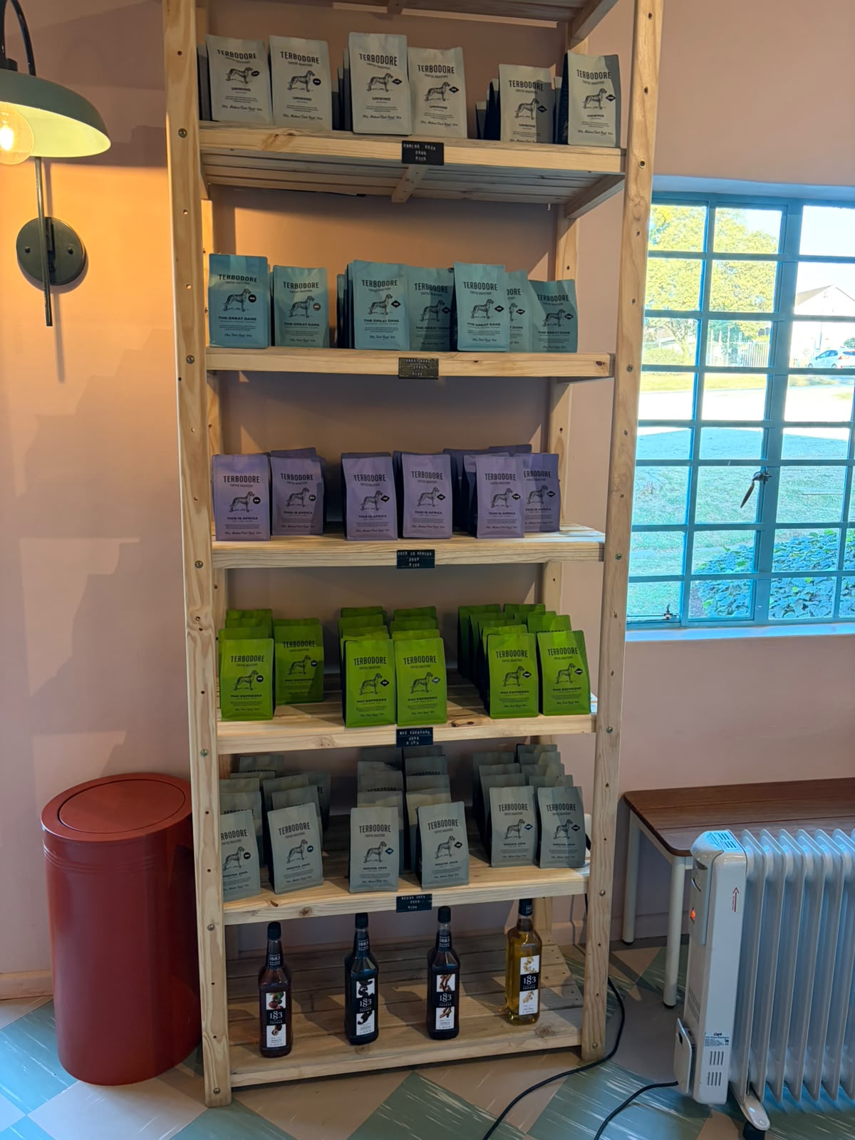 Shelf of Terbodore blue bags — The Great Dane blend and single origins
