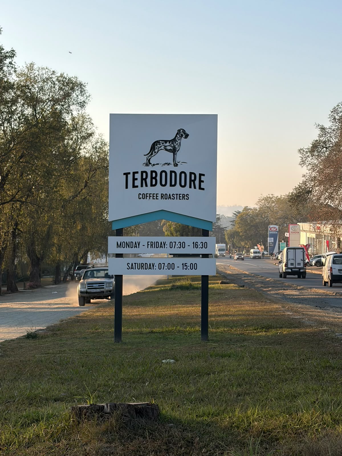 Terbodore road sign — Great Dane logo, trading hours, Main Road Howick