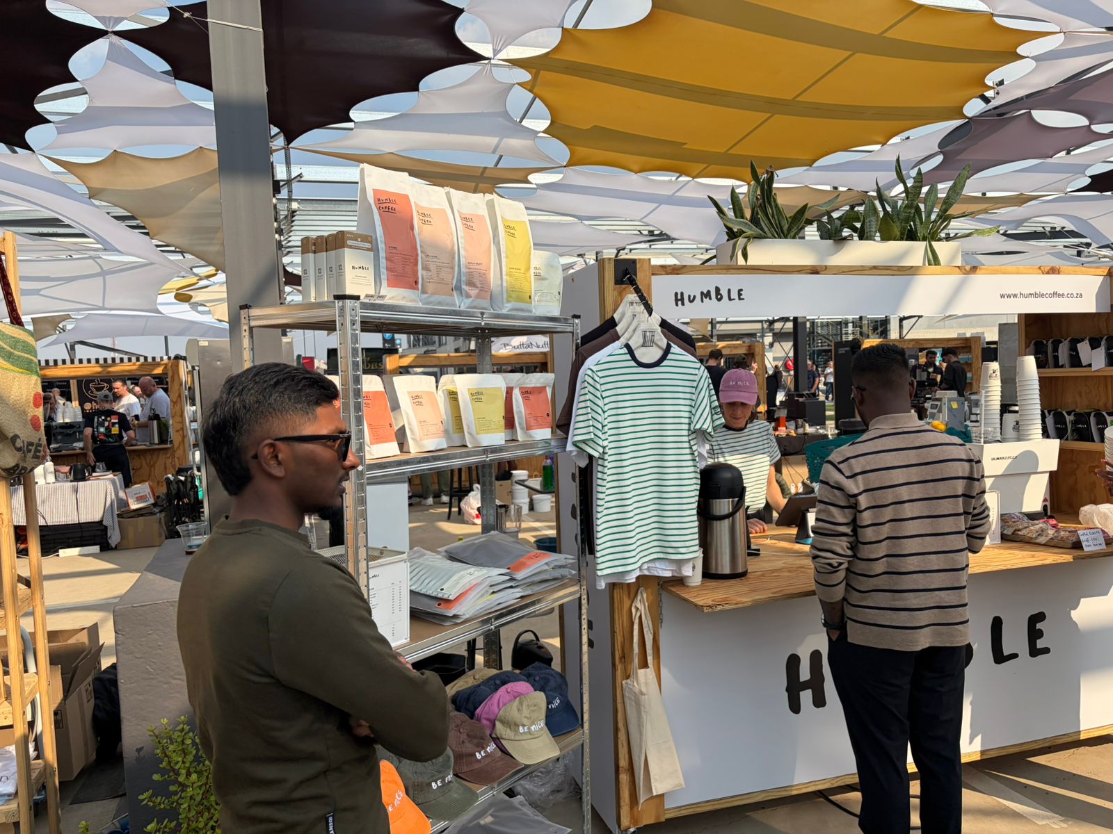 Customers browsing Humble Coffee bags and merchandise at the Jo'burg Coffee Festival