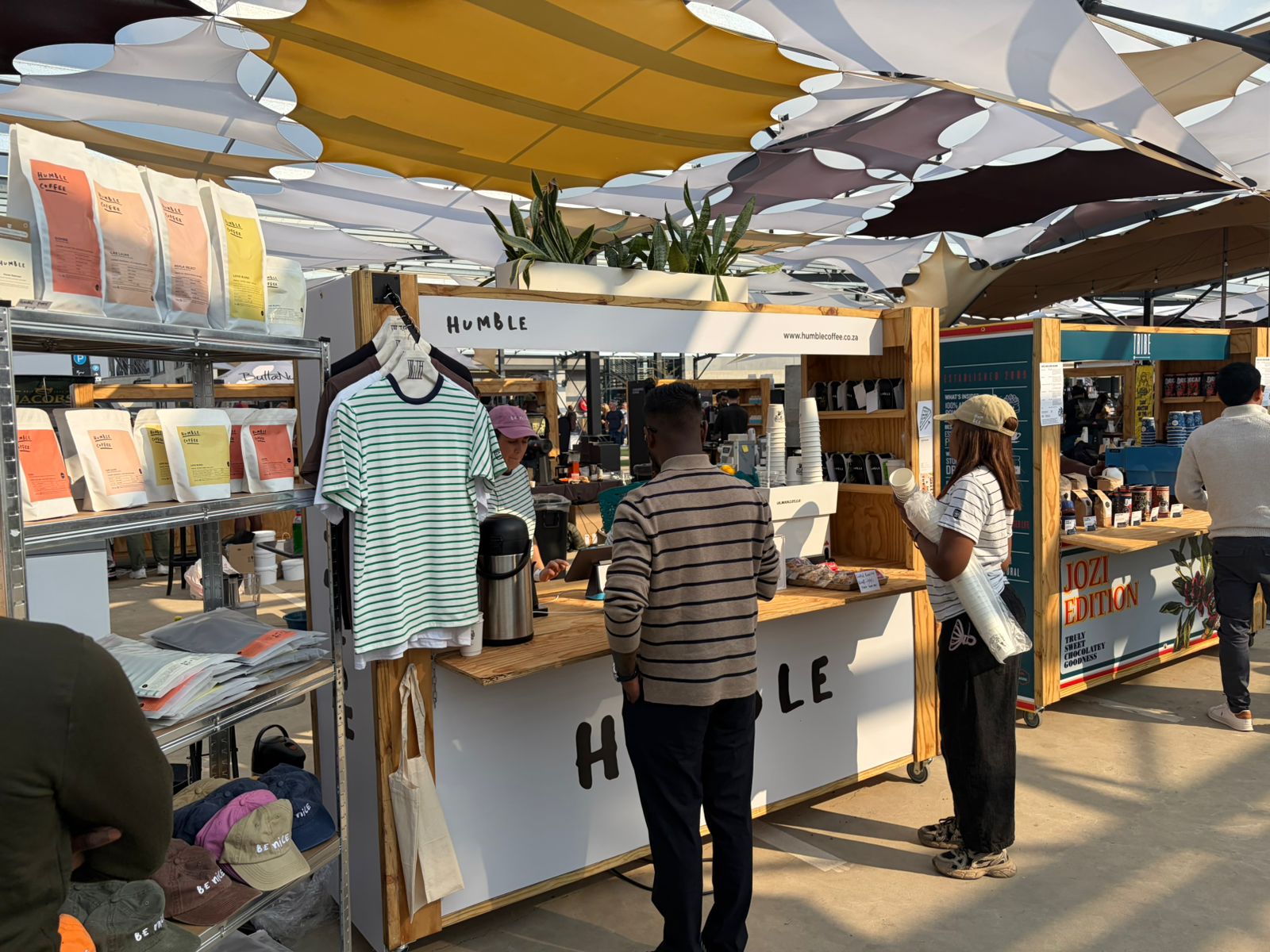 Humble Coffee festival booth with colourful bags and the Jozi Edition sign